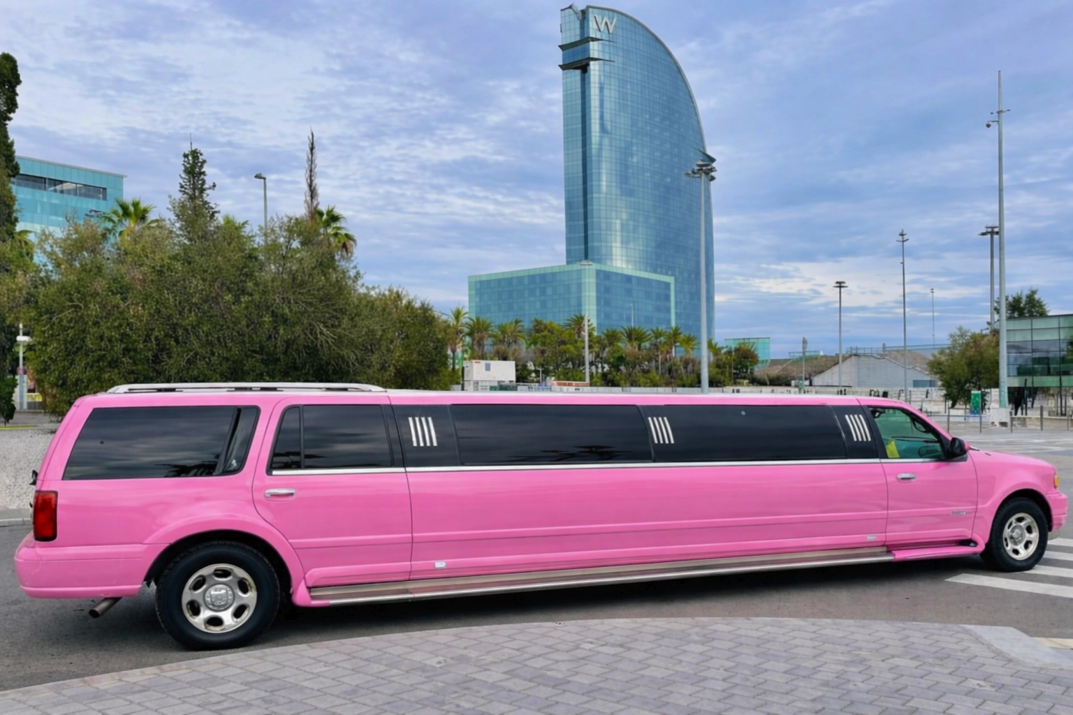 Pink Hummer limousine in Barcelona offering luxury party transport for birthdays, hen parties and private celebrations