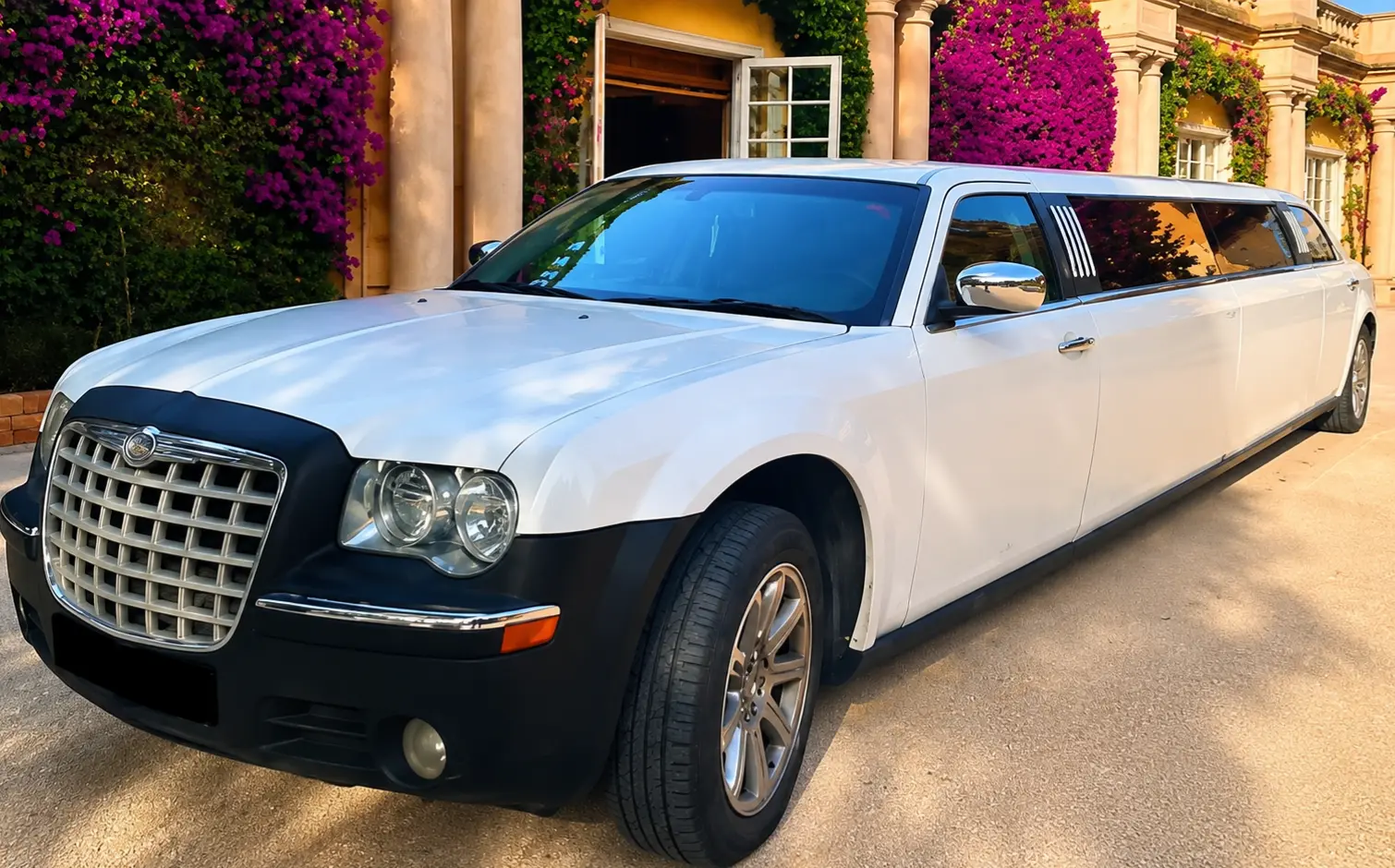 Luxury white Chrysler limousine hire in Barcelona for weddings and special events